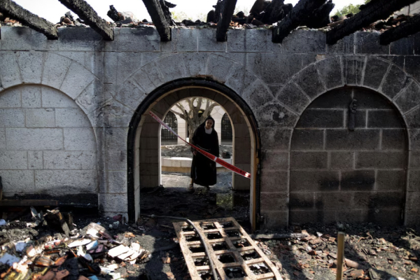 A nun inspects damage